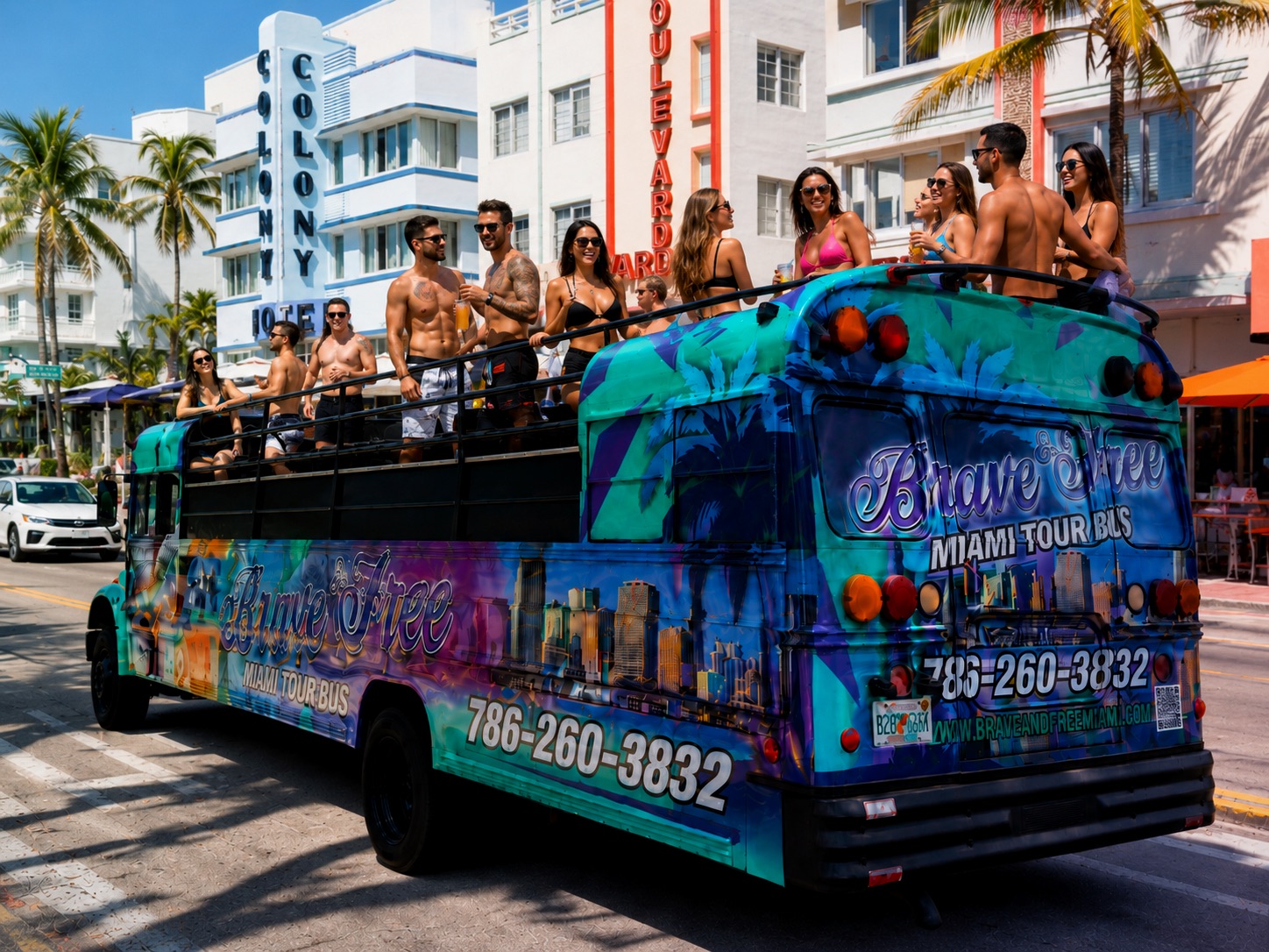 Brave & Free bus rolling down Ocean Drive past the Colony Hotel